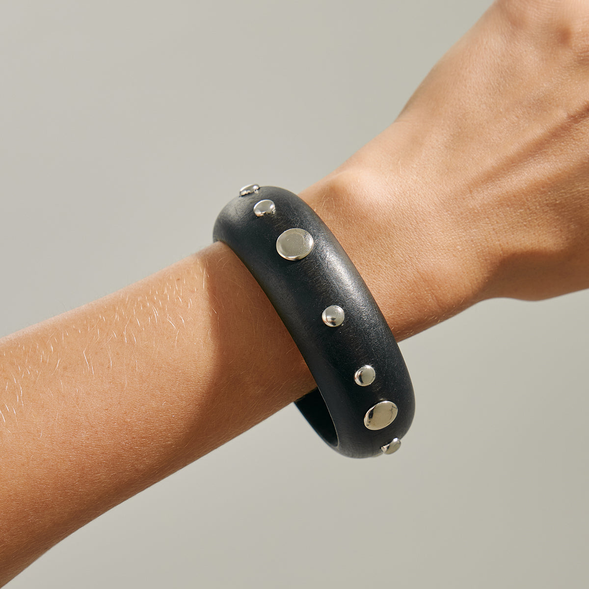 Black Wood and Silvertone Spot Station Bangle, silver bangle bracelet, botanical inspired, styled look