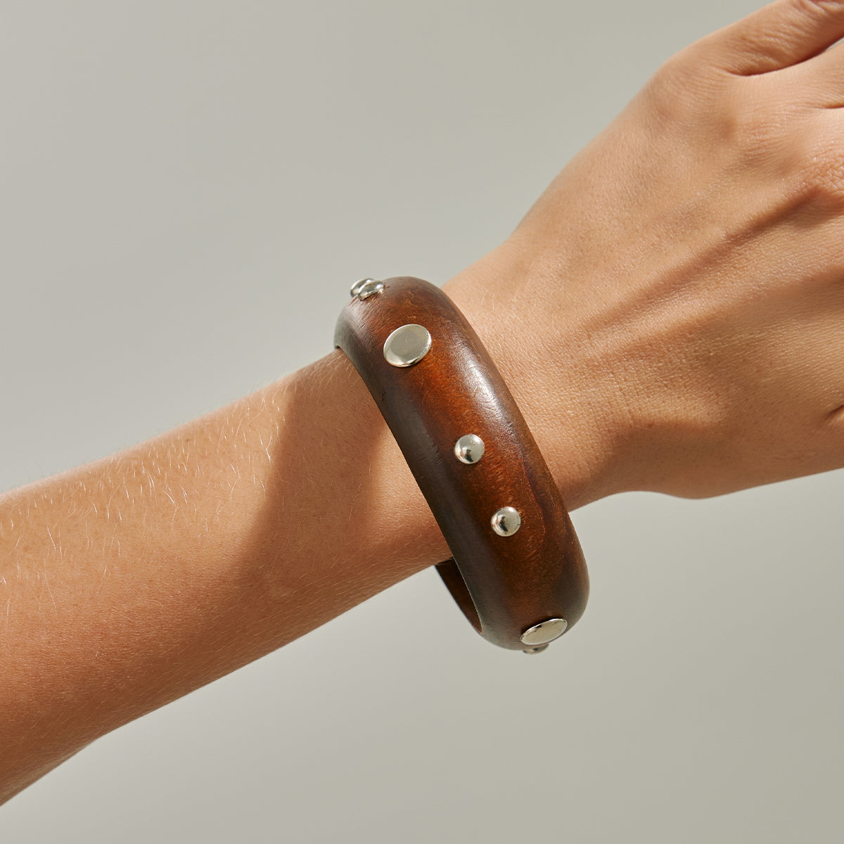 Brown Wood and Silvertone Spot Station Bangle, silver bangle bracelet, botanical inspired, styled look