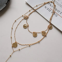 18K gold-plated lariat necklace adorned with a coin chain and a striking 'Capricorn' pendant for a chic look.