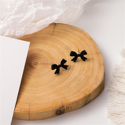 Black Enamel Bow Stud Earrings, stud earrings for women, everyday style, detail close-up