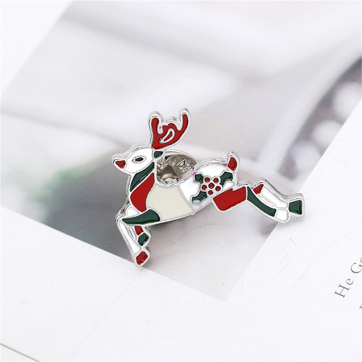 Red Enamel and Silver-Plated Reindeer Brooch, silver brooch pin, dainty minimalist design, side view