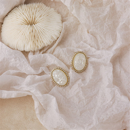 White Resin and 18K Gold-Plated Oval Stud Earrings, gold stud earrings for women, dainty minimalist design, side view