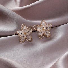 Dazzling flower-shaped earrings in gold-plated frame, set with clear acrylic, perfect for adding glamour to your jewelry collection.