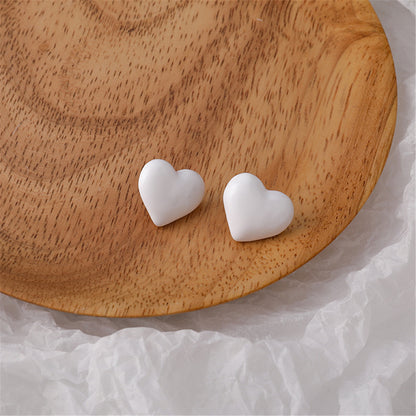 White Enamel and Silver-Plated Heart Stud Earrings, silver stud earrings for women, everyday style, front view