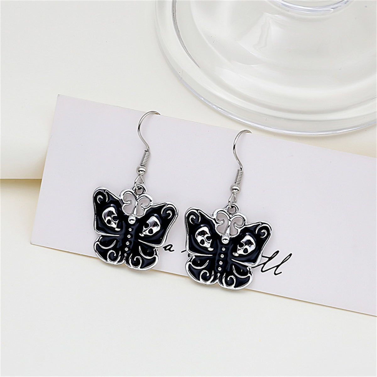 Black and Silver-Plated Skull Butterfly Drop Earrings, silver drop earrings for women, everyday style, side view