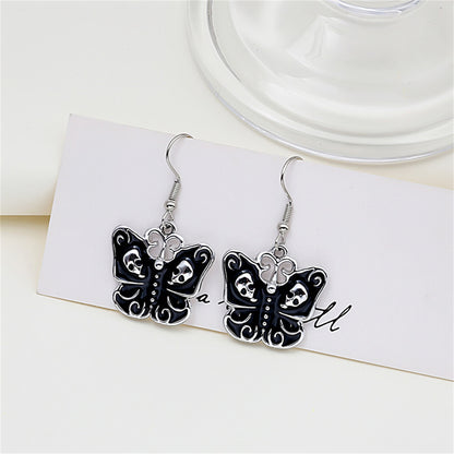 Black and Silver-Plated Skull Butterfly Drop Earrings, silver drop earrings for women, everyday style, side view