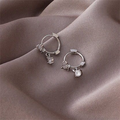 Cubic Zirconia and Silver-Plated Butterfly Huggie Earrings, silver huggie earrings, dainty minimalist design, lifestyle look