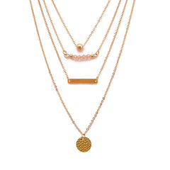 Stunning trio of layered necklaces with gold-plated charms, showcasing a beautiful 18K gold-plated bar and beaded design.