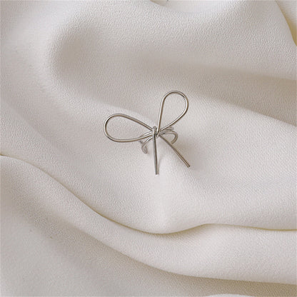 Silver-Plated Bow Ear Cuff, silver stud earrings for women, dainty minimalist design, front view