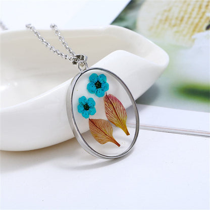 Blue and Green Pressed Flower Oval Pendant Necklace, pendant necklace for women, botanical inspired, front view