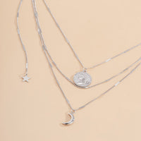 Silvertone Moon & Star Layered Pendant Necklace