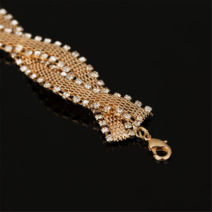 Cubic Zirconia and 18K Gold-Plated Crossing Weaving Bracelet, gold bracelet for women, detail close-up
