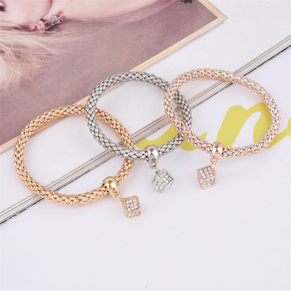 Cubic Zirconia and Three-Tone Hollow Cube Charm Bracelet Set, jewelry gift sets for women, everyday style, detail close-up