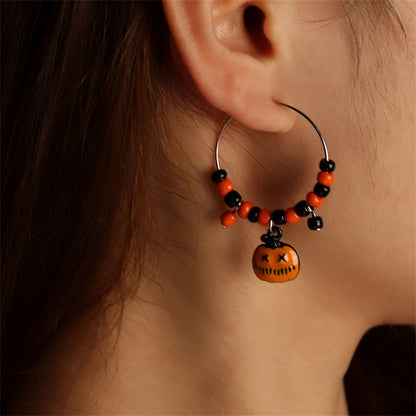 Orange Howlite and Silver-Plated Pumpkin Huggie Earrings, silver huggie earrings, vintage-inspired design, detail close-up