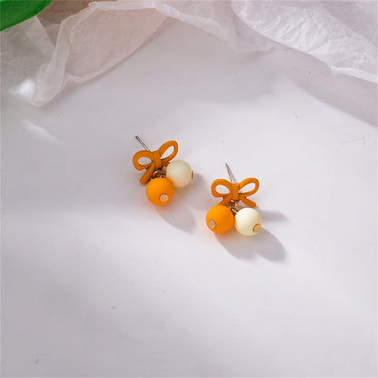 Yellow Enamel and 18K Gold-Plated Bow Drop Earrings, gold drop earrings for women, everyday style, side view