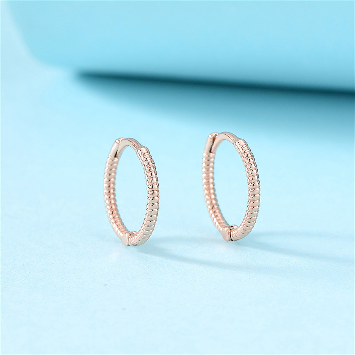 18K Rose Gold-Plated Textured Huggie Earrings, rose gold huggie earrings, vintage-inspired design, side view