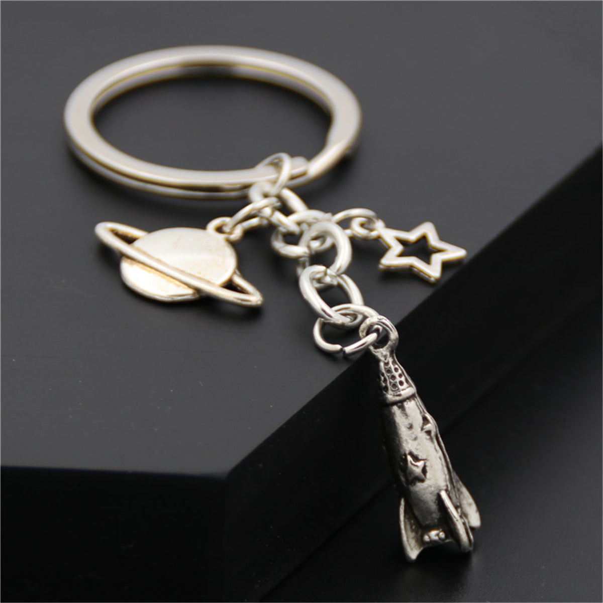 Silver-Plated Rocket Key Chain, silver pendant necklace for women, botanical inspired, side view