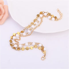 Stunning 18K gold-plated anklet with a gold chain and white beads, perfect for adding a touch of elegance to any outfit.