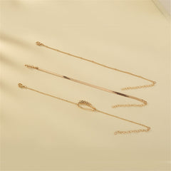 Three exquisite gold bracelets with a chain and leaf charm, beautifully designed in 18K gold plating for a luxurious touch.