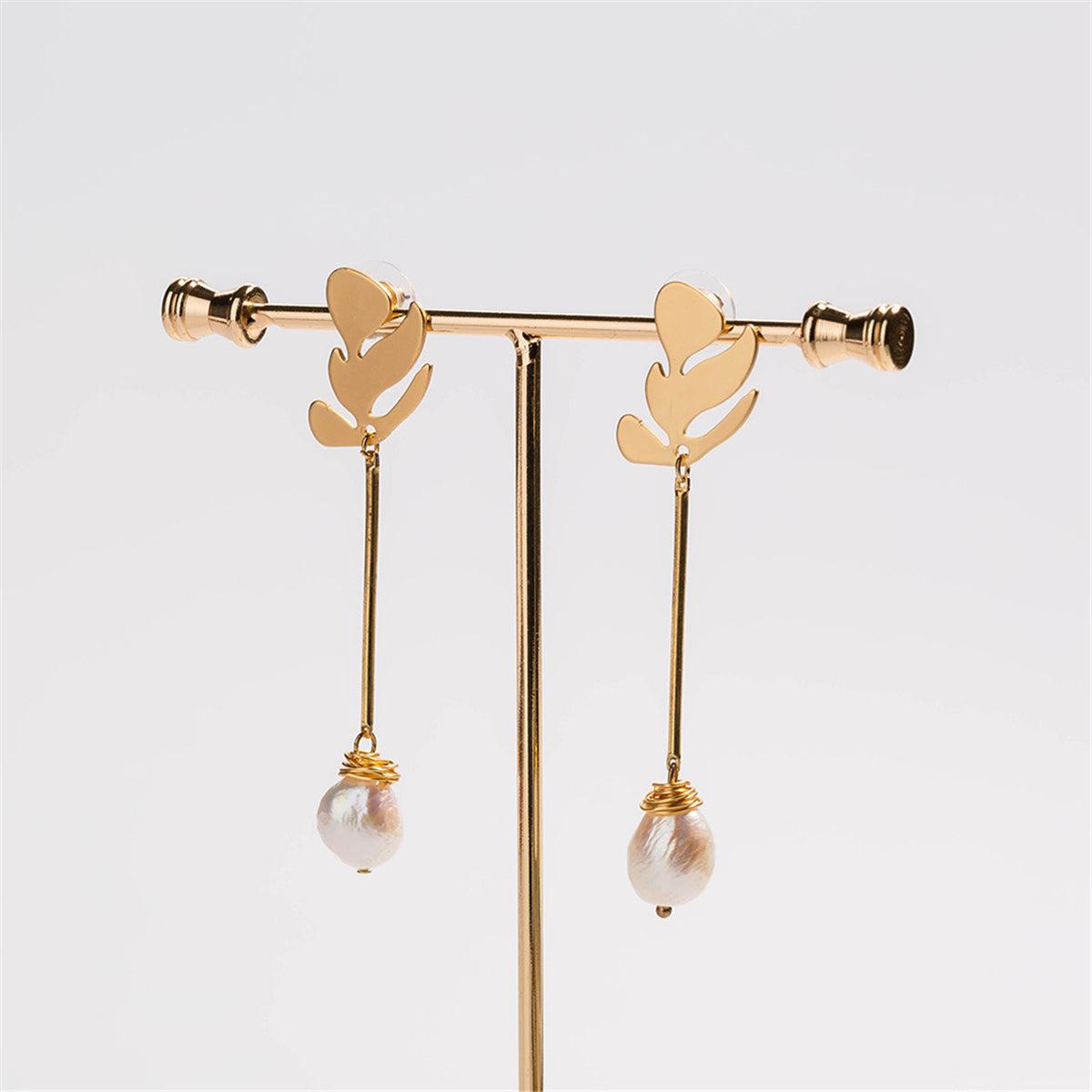 Pearl and 18K Gold-Plated Leaf Drop Earrings, gold drop earrings for women, vintage-inspired design, detail close-up