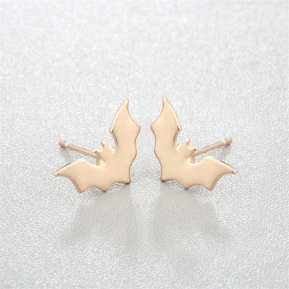 Unique 18K gold-plated bat stud earrings, perfect for Halloween enthusiasts wanting to showcase their festive spirit.