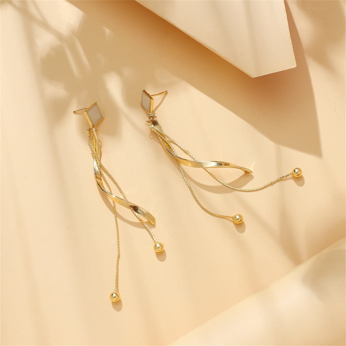 White Enamel and 18K Gold-Plated Rhombus Twisted Tassel Drop Earrings, gold drop earrings for women, detail close-up
