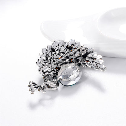 Clear Cubic Zirconia and Silver-Plated Peacock Brooch, silver brooch pin, dainty minimalist design, lifestyle look