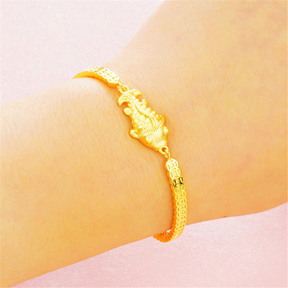 24K Gold-Plated Fish Charm Bracelet, gold bracelet for women, botanical inspired, lifestyle look