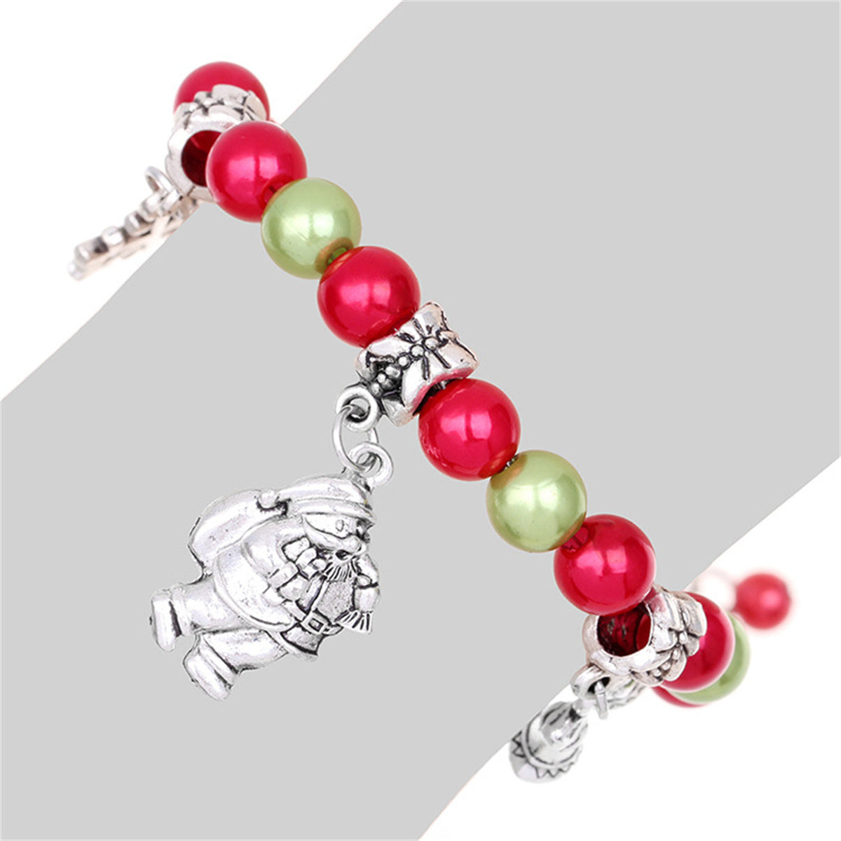 Red and Green Santa Snowflake Bell Beaded Charm Bracelet, bracelet for women, botanical inspired, detail close-up