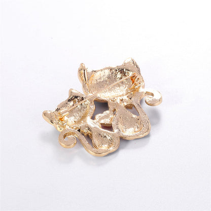 Black Enamel and 18K Gold-Plated Double-Cat Brooch, gold brooch pin, vintage-inspired design, styled look