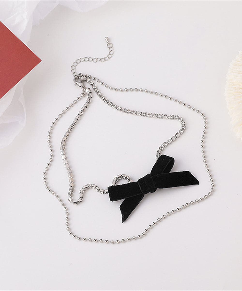 Cubic Zirconia and Silver-Plated Bow Layered Necklace, silver pendant necklace for women, vintage-inspired design, side view