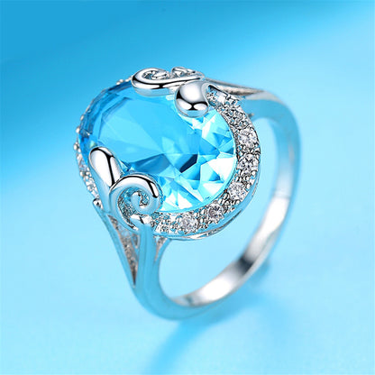 Blue Topaz and Cubic Zirconia Oval Halo Ring, statement rings for women, dainty minimalist design, detail close-up
