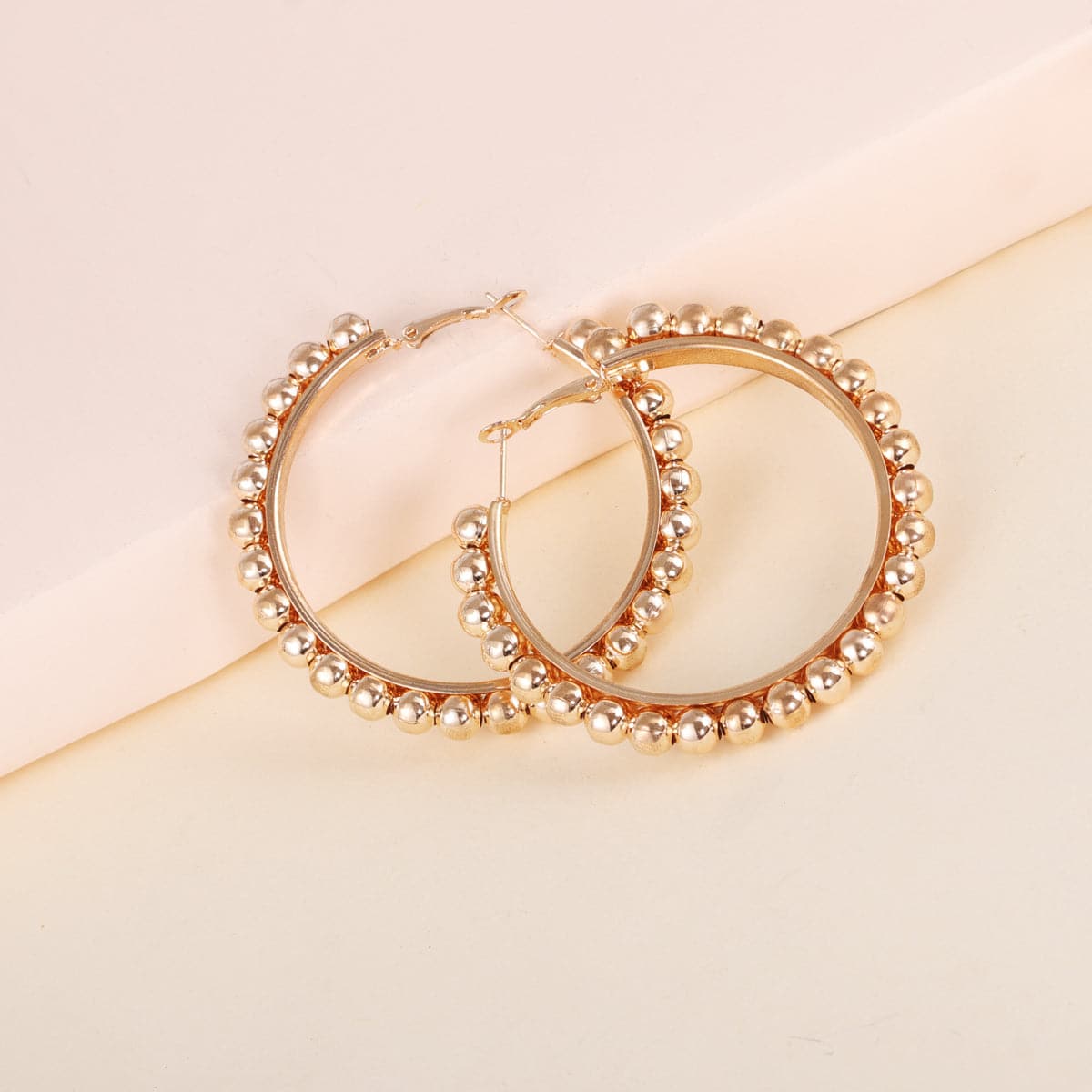 Chic 18K gold-plated bead hoop earrings made from metal, a must-have accessory to enhance your everyday style.