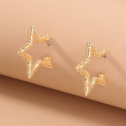 18K Gold-Plated Open Star Huggie Earrings, gold huggie earrings, vintage-inspired design, lifestyle look