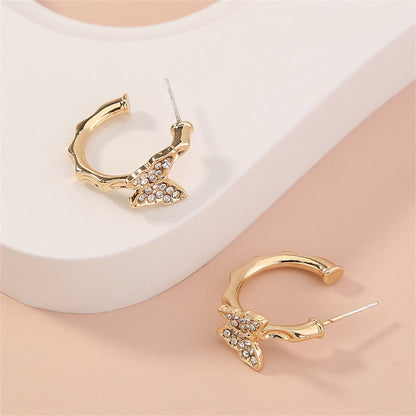 Cubic Zirconia and 18K Gold-Plated Butterfly Huggie Earrings, gold huggie earrings, everyday style, lifestyle look