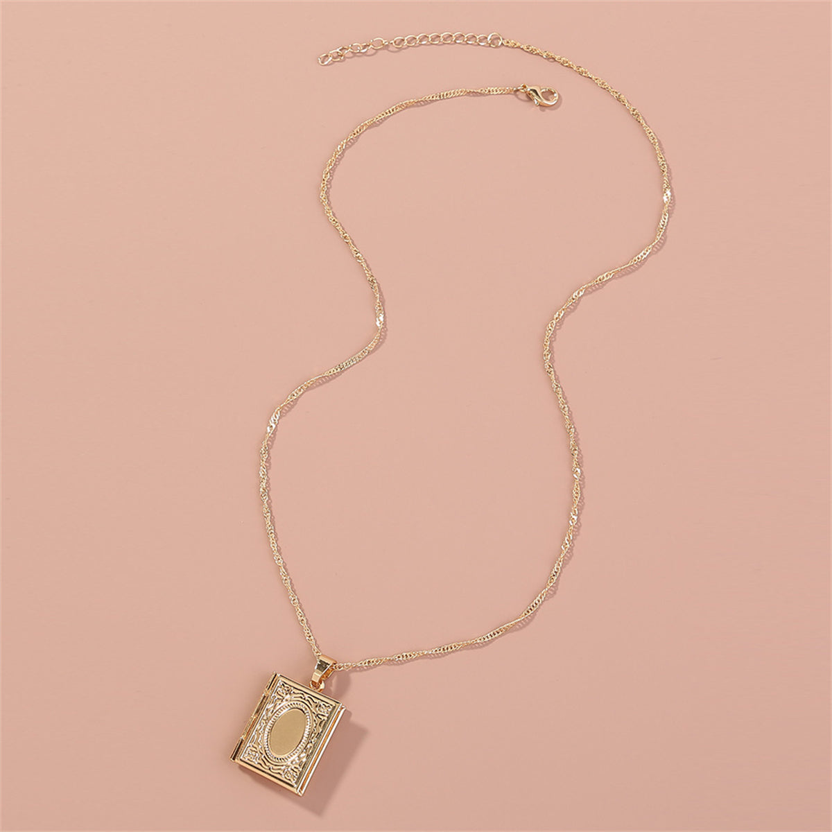 Charming 18K gold-plated locket with a book inside, a unique piece to hold your favorite memories and tales.