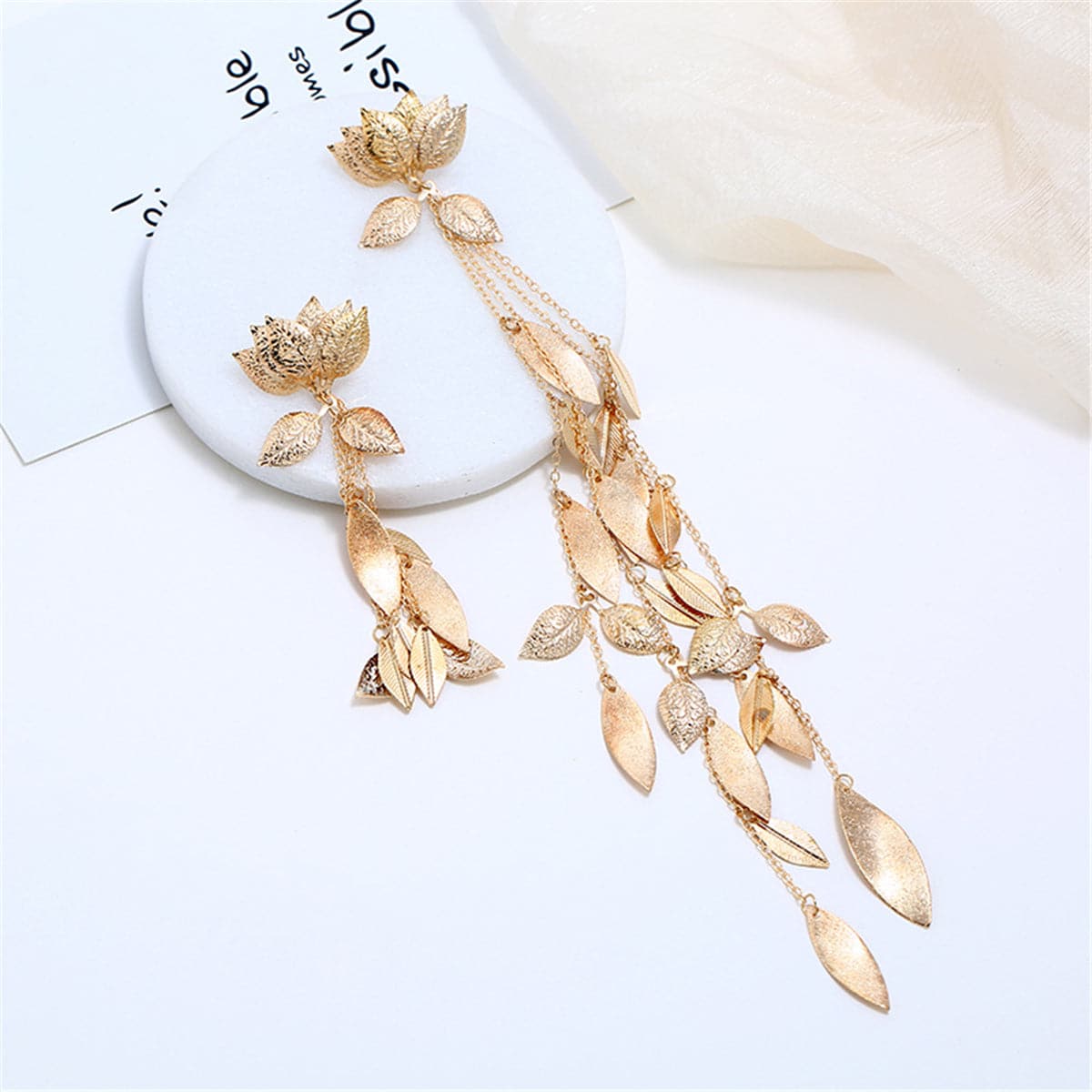 Exquisite 18K gold plated drop earrings with a charming lotus and leaf design, perfect for a stylish accessory.