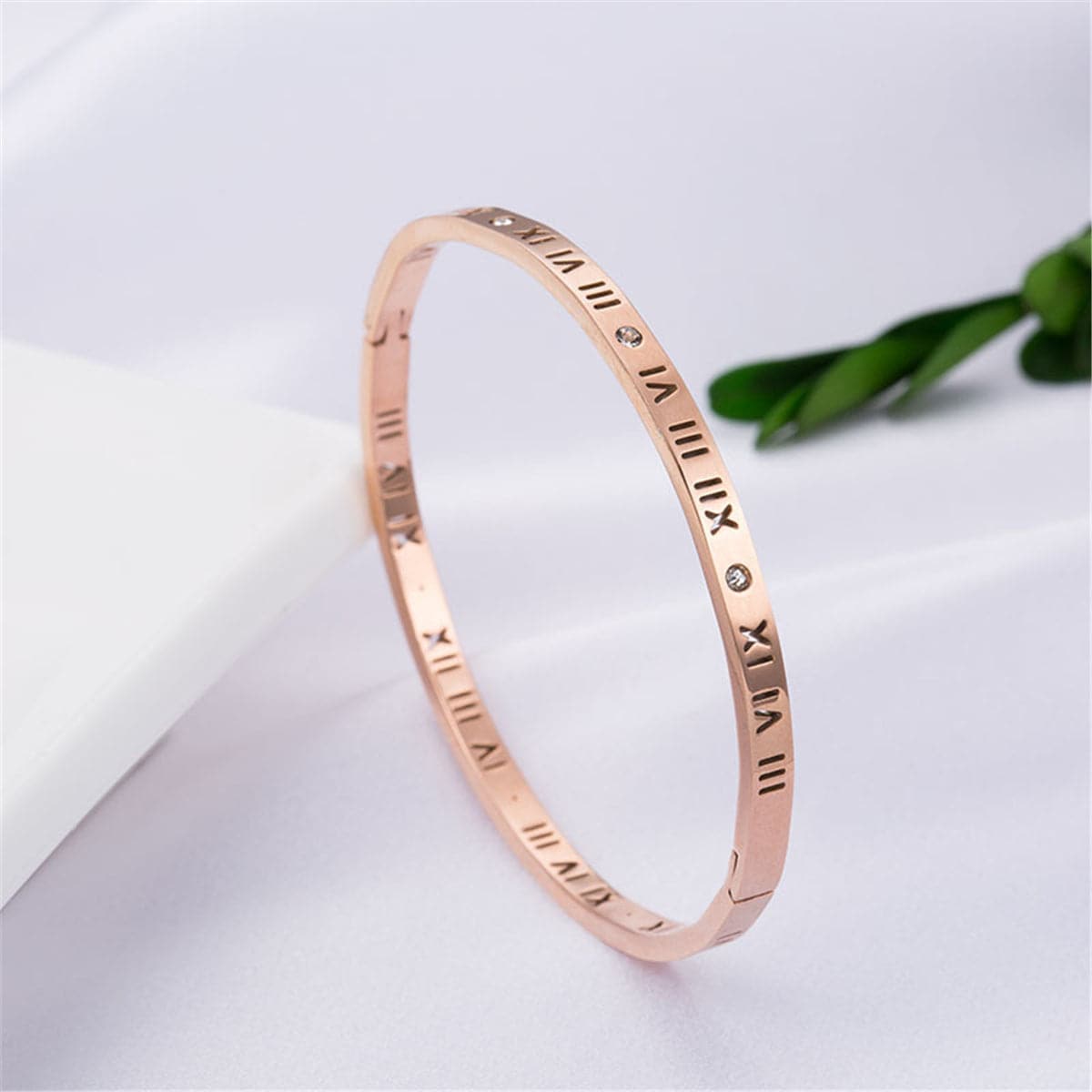 Cubic Zirconia and 18K Rose Gold-Plated Roman Numeral Bangle, rose gold bangle bracelet, everyday style, detail close-up