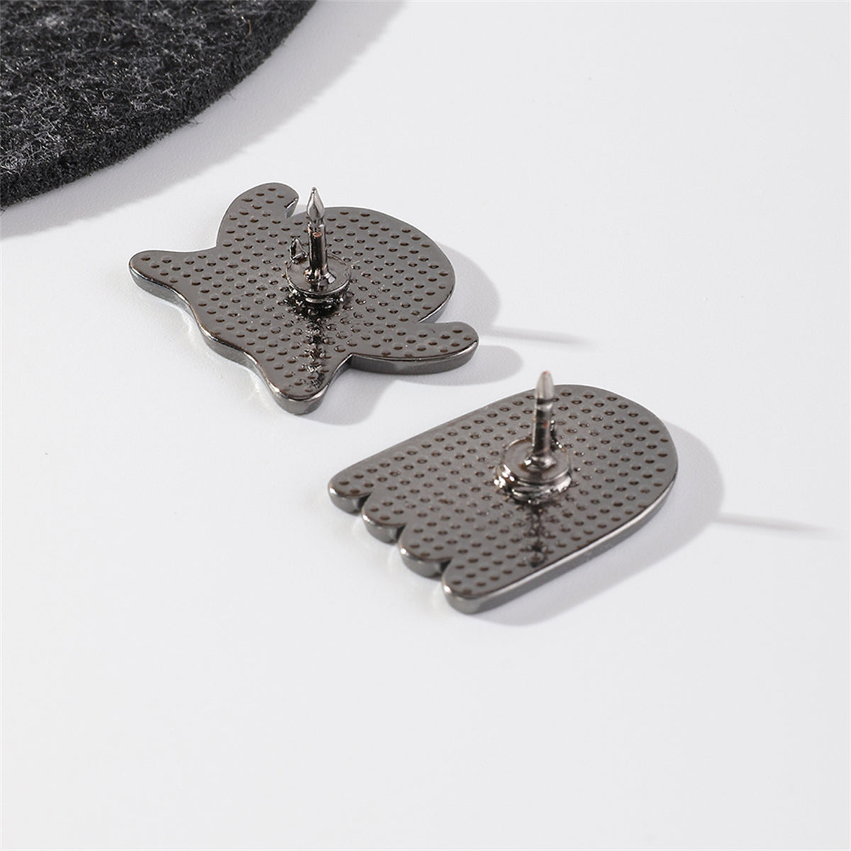 White and Silver-Plated Ghost Enamel Pin Set, silver brooch pin, dainty minimalist design, detail close-up