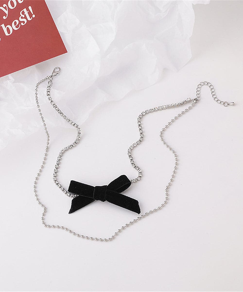 Cubic Zirconia and Silver-Plated Bow Layered Necklace, silver pendant necklace for women, detail close-up