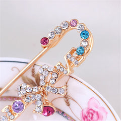 Elegant gold-plated brooch featuring a bow accent, beautifully set with colorful cubic zirconia stones for a refined look.
