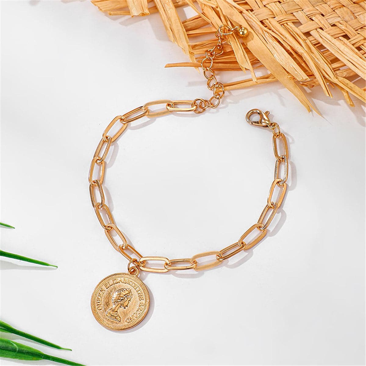 Dazzling gold anklet with a coin charm, crafted in 18K gold plating, perfect for a fashionable and trendy statement.