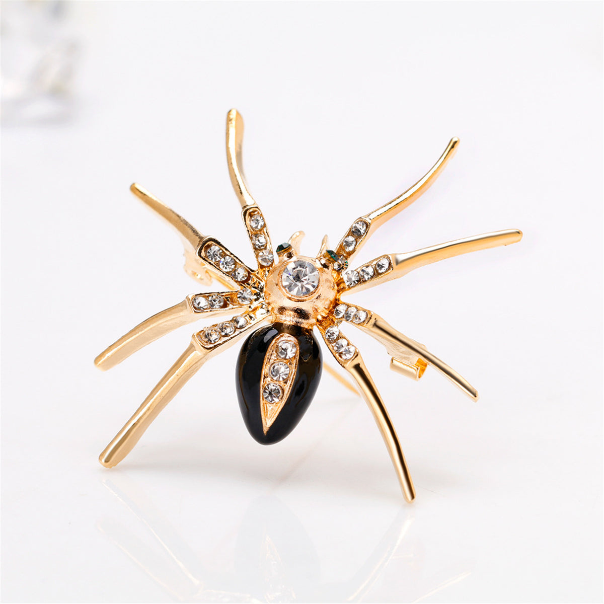 Cubic Zirconia and Black Enamel 18K Gold-Plated Spider Brooch, gold brooch pin, vintage-inspired design, front view