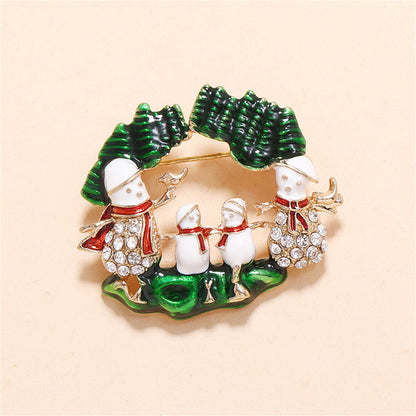 Cubic Zirconia and Green Snowman Family Brooch, brooch pin, botanical inspired, detail close-up