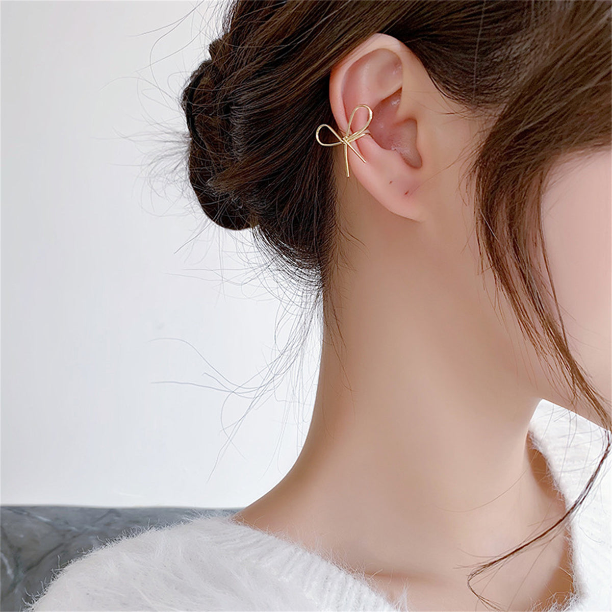 Silver-Plated Bow Ear Cuff, silver stud earrings for women, dainty minimalist design, lifestyle look