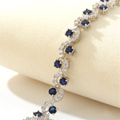 Cubic Zirconia & Blue Crystal Prong Crossing Line Tennis Bracelet