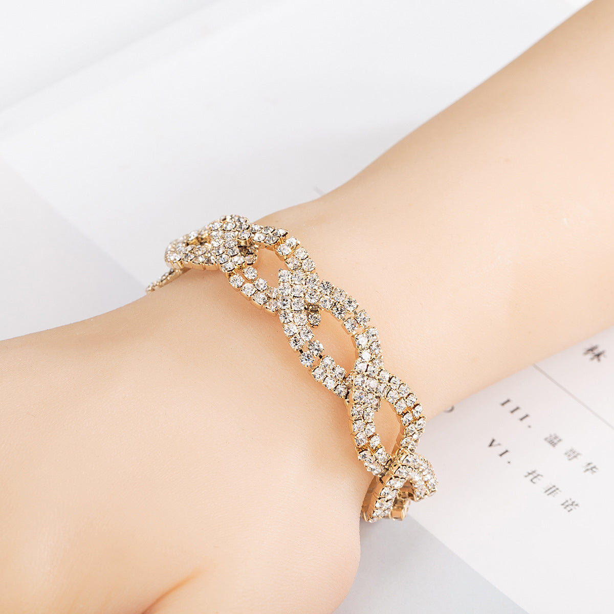 Cubic Zirconia and 18K Gold-Plated Crossing Line Bracelet, gold bracelet for women, botanical inspired, detail close-up