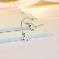 Cubic Zirconia & Silvertone Star & Moon Pendant Necklace