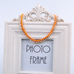 Stunning orange and gold chain anklet, featuring durable polyester and luxurious 18K gold plating for a chic look.