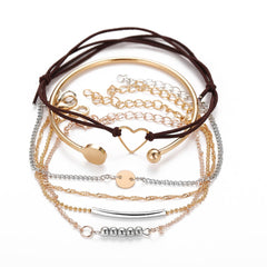 Elegant bracelet set with 18K gold and silver plating, showcasing a beautiful heart charm in a stacked design.
